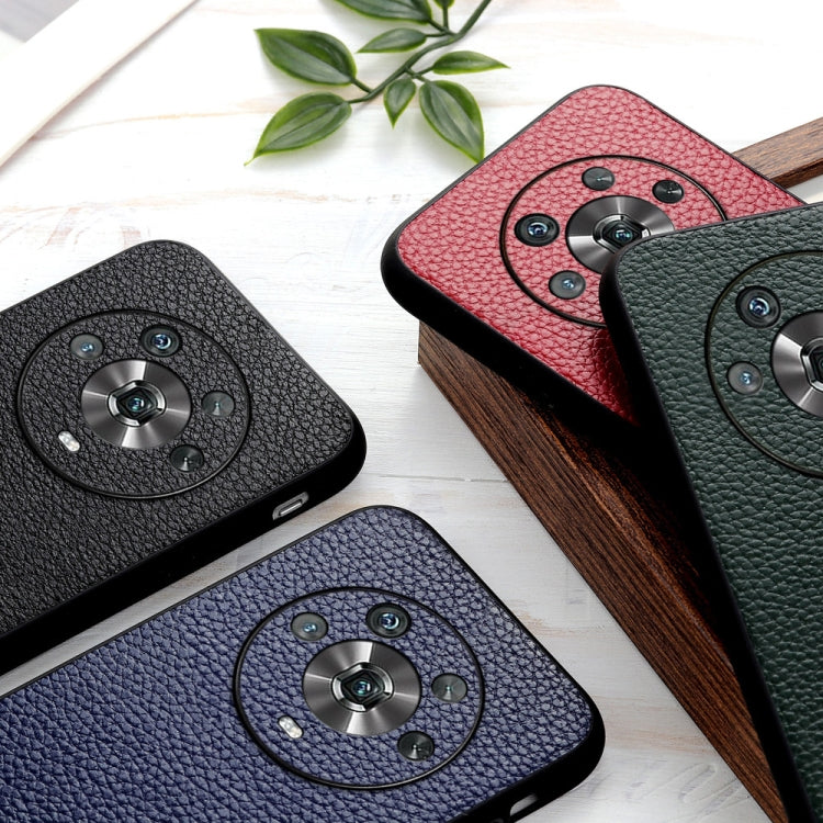 Set of four genuine leather phone cases in black, red, blue, and green with camera cutouts.