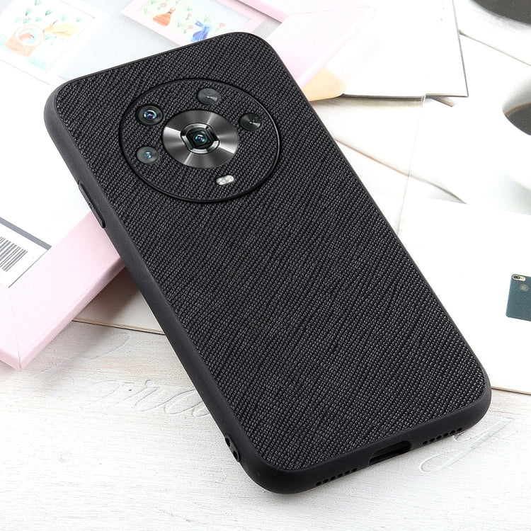 Black genuine leather phone case with textured finish and circular camera ring