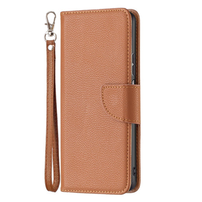 Brown textured leather horizontal flip phone case with front flap and wrist strap