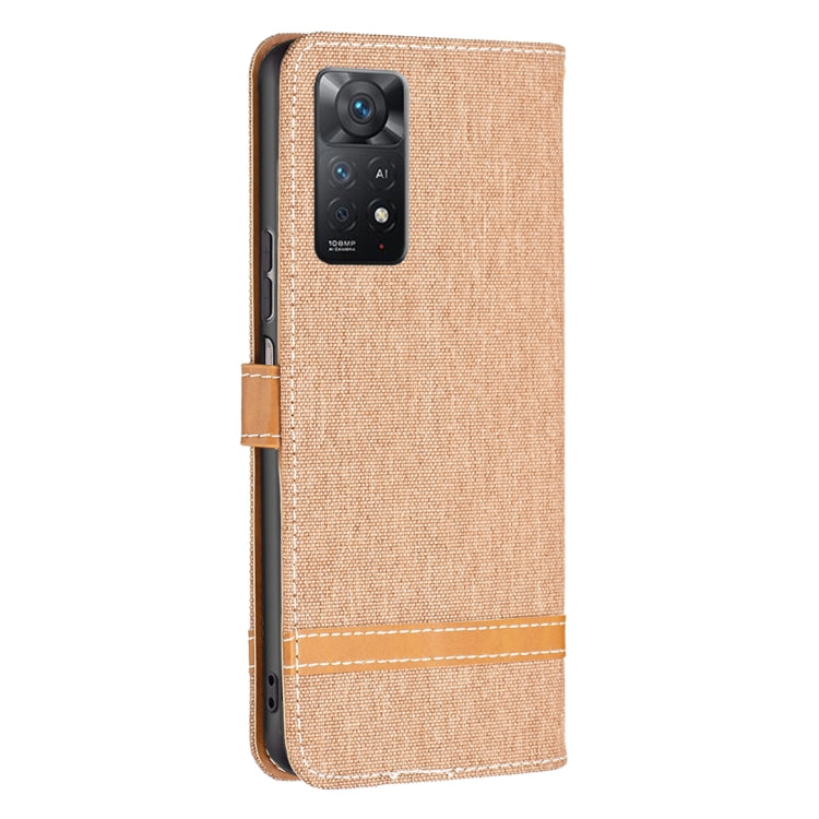 Brown denim-texture leather phone case with camera cutout and closure strap