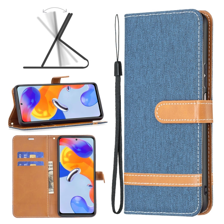 Blue denim-texture phone case with flip cover, tan card slot, and wrist strap.