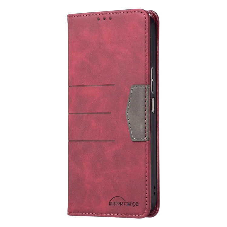 Red leather folio phone case with side pocket and magnetic clasp, closed view.