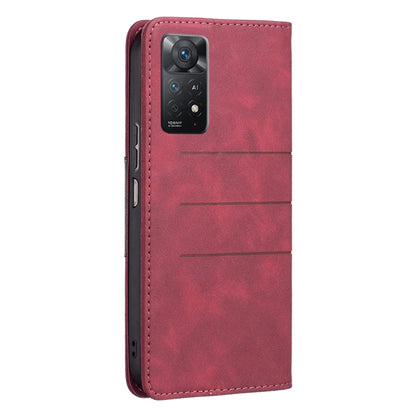 Red leather folio phone case with camera cutout and side button openings, back view.