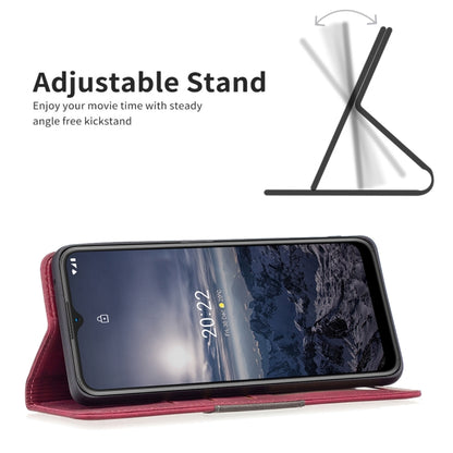 Red leather phone case with flip cover and built-in adjustable stand for viewing.