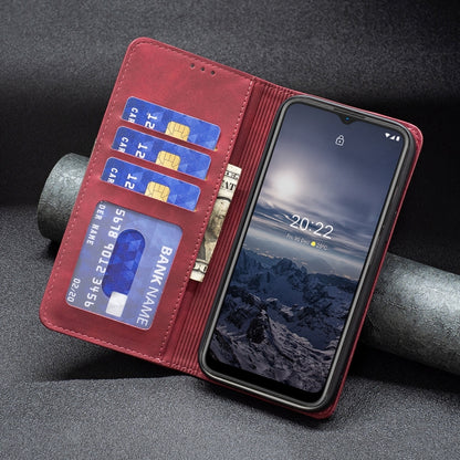Red leather magnetic flip phone case with card holder and visible phone screen in it.