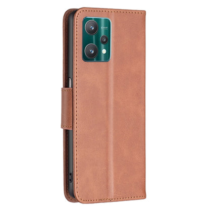 Tan leather phone case with camera cutout and flip card pocket, wrist strap