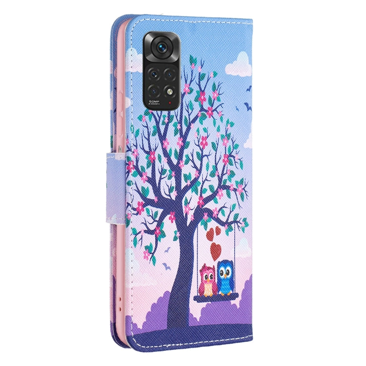 Light blue flip phone case with tree, owl, and floral pattern; camera cutout