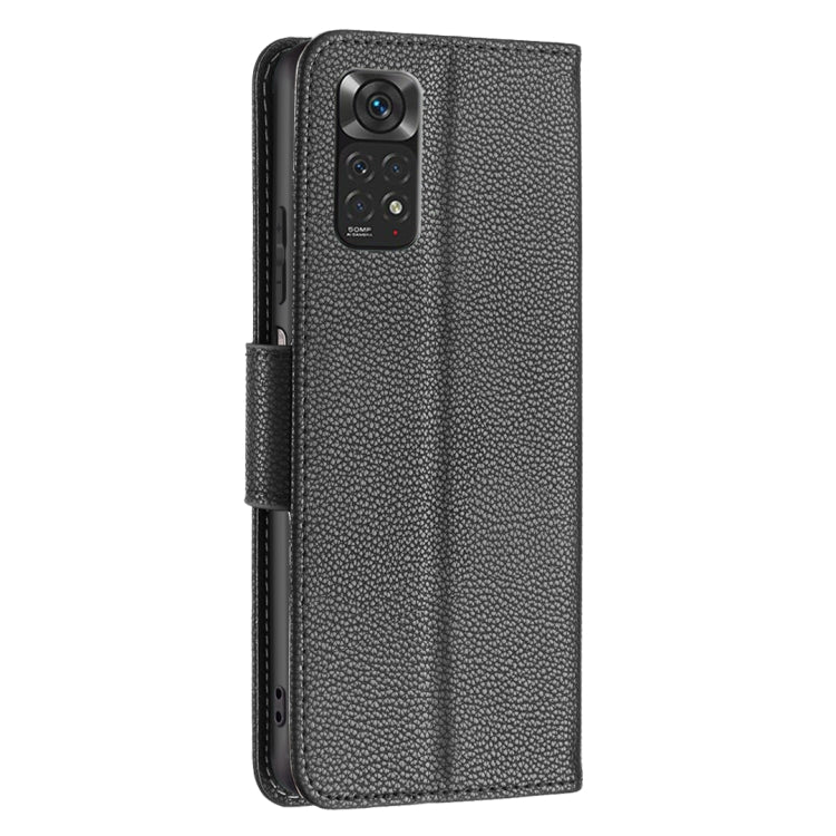 Dark gray textured leather folio phone case with cover strap and camera cutout.
