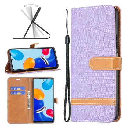 Purple fabric wallet phone case with tan card slot and wrist strap for phone protection