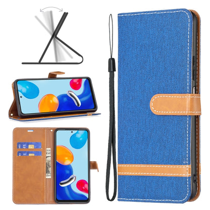 Blue fabric wallet phone case with tan card slot and wrist strap, textured fabric cover