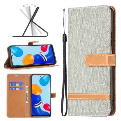 Fabric phone case with tan leather accents and wrist strap, front slot and stitched details
