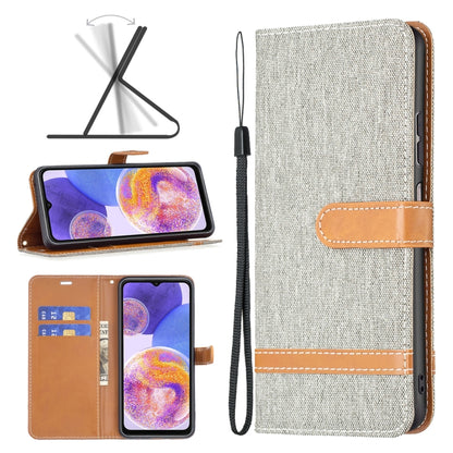 Textured fabric phone case with tan leather strap, front pocket opening, stitched trim