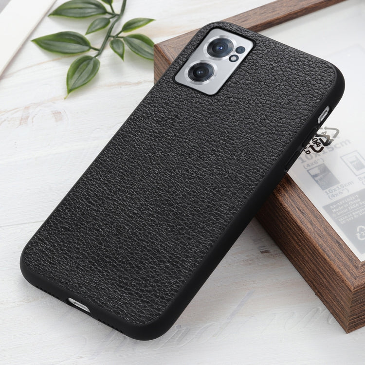 Litchi-textured genuine leather phone case, black, angled front with camera module