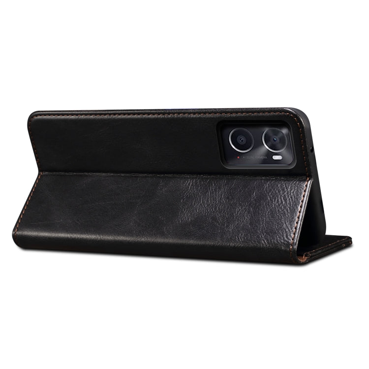 Black leather-look flip phone case with stand angle and stitched outer edge.