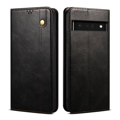 Black leather-look flip phone case front and back, with gold snap and camera window.