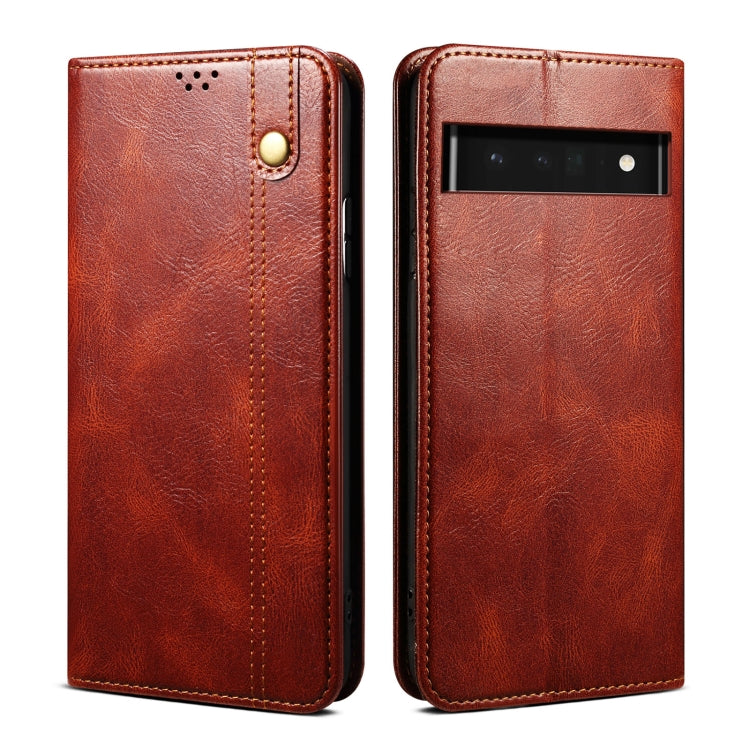 Brown wallet-style leather phone case with textured finish and camera opening on back.