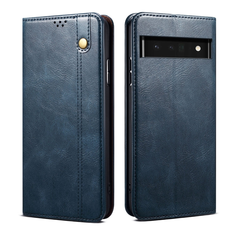 Blue oil-wax leather phone case with textured finish and raised camera cutout.