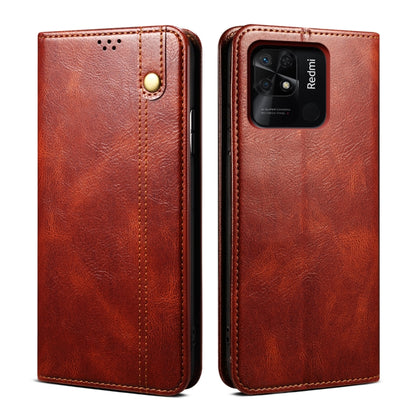 Brown oil-wax leather phone case with card slot and magnetic snap, textured finish