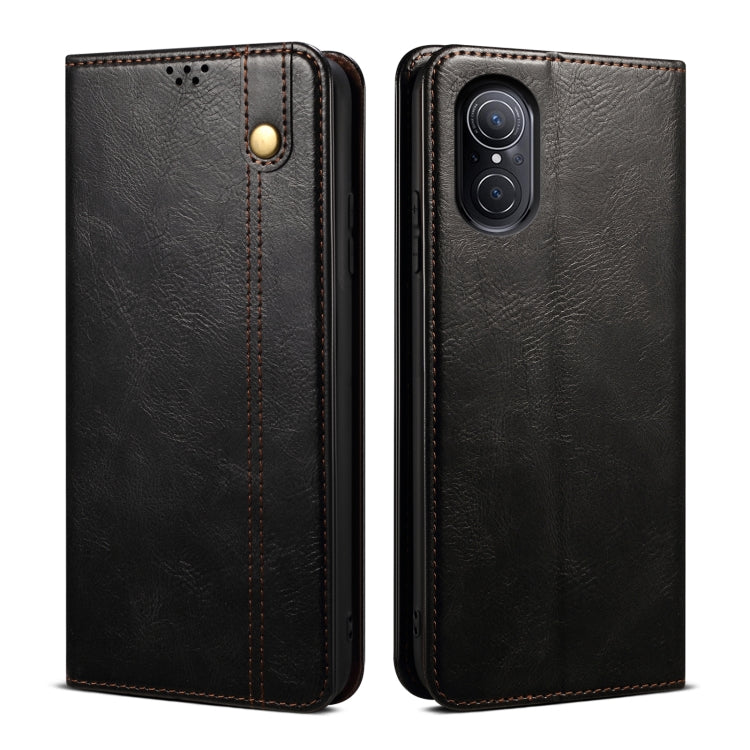 Black leather-look flip phone case front and back with gold snap and dual camera cutout.