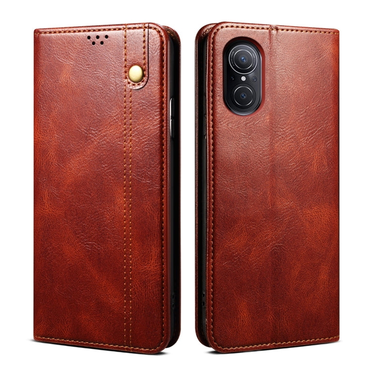 Brown leather phone case with visible camera cutout and embossed texture front and back.