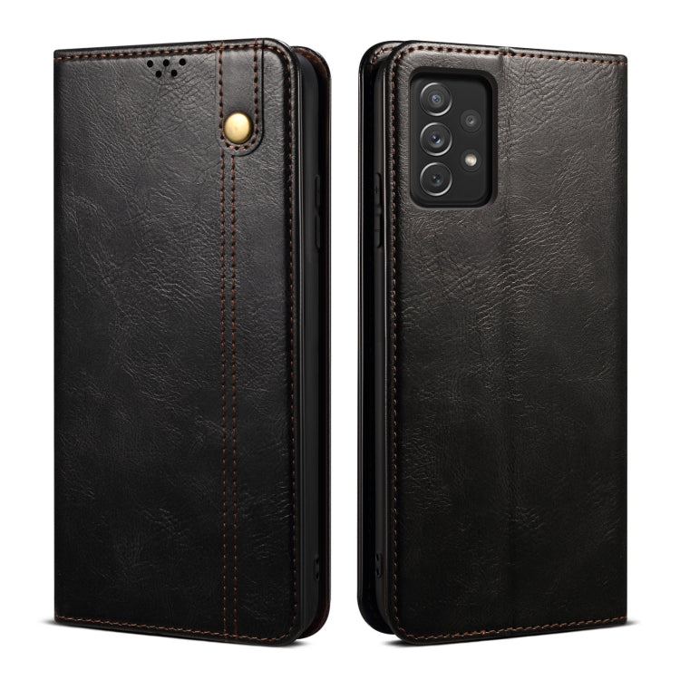 Black leather phone case with textured finish, camera opening, and gold-tone snap button.