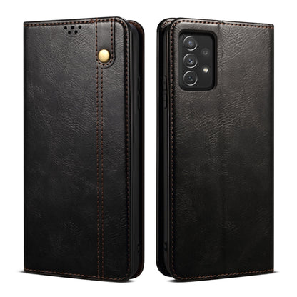 Black leather phone case with textured finish, camera opening, and gold-tone snap button.