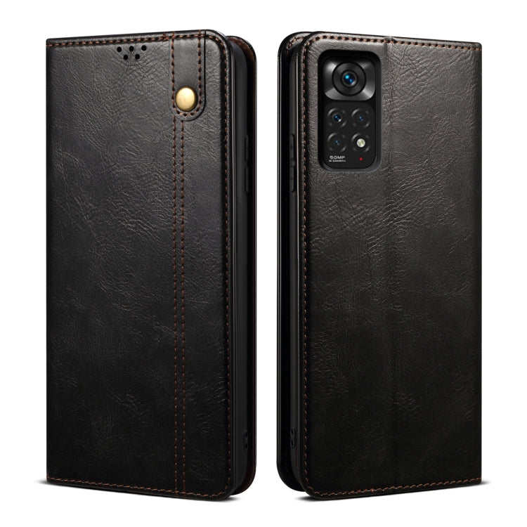 Black leather phone case with textured surface and camera openings for multiple lenses.