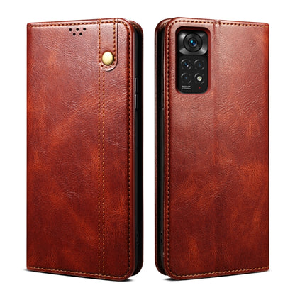Red-brown oil-wax leather phone case with card slot and magnetic snap, textured finish