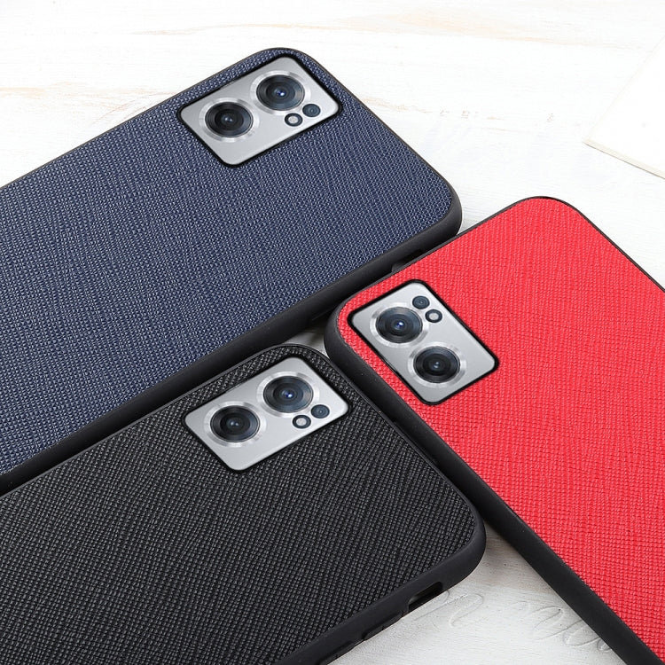 Leather phone cases in navy, black, and red with cross-texture and camera cutouts