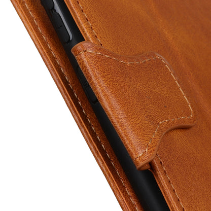 Brown leather flip phone case close-up of stitching and side magnetic tab