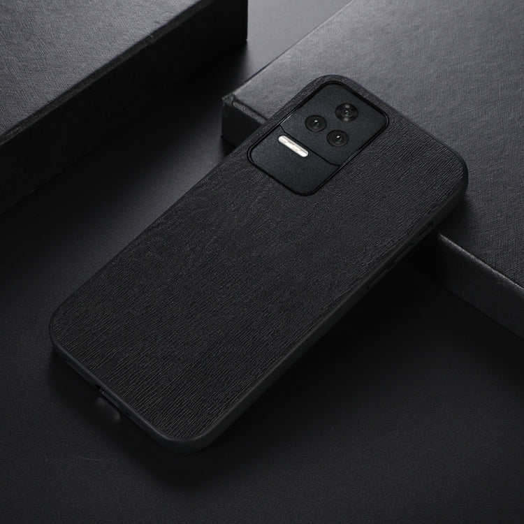 Black wood-texture PU phone case with camera cutout, slim profile