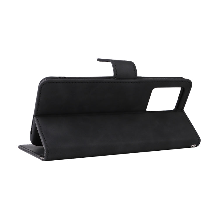 Black leather-style folio phone case folded into landscape stand with camera cutout