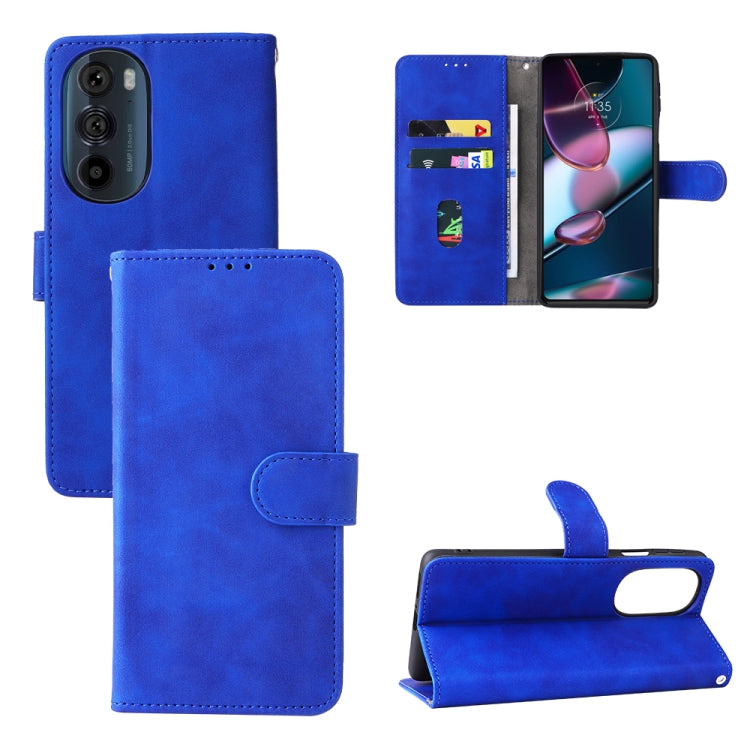 Blue folio leather phone case with magnetic closure, side button cutouts, and stand