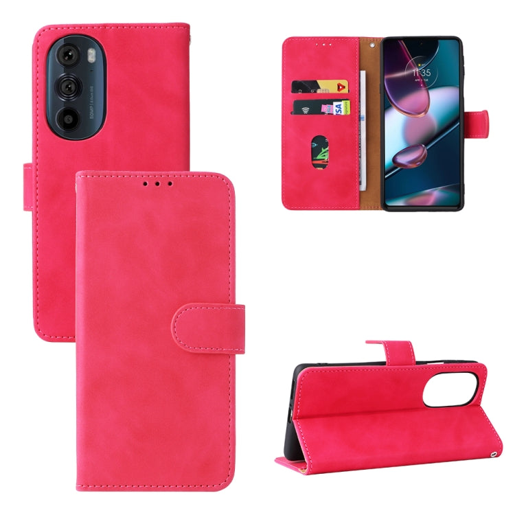 Pink folio leather phone case with magnetic closure and side cutouts, shown open