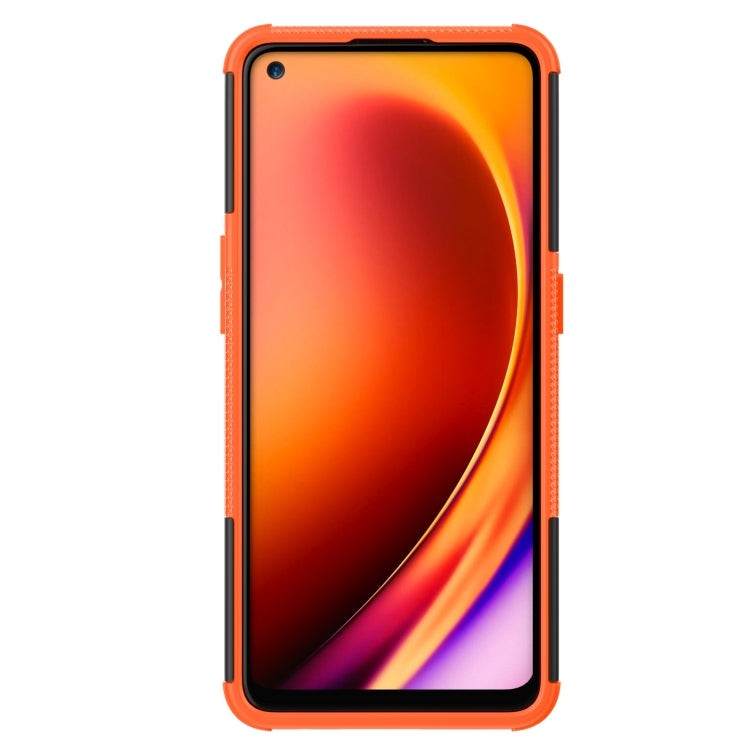 Orange shockproof phone case with tire texture, raised edges, and camera cutout