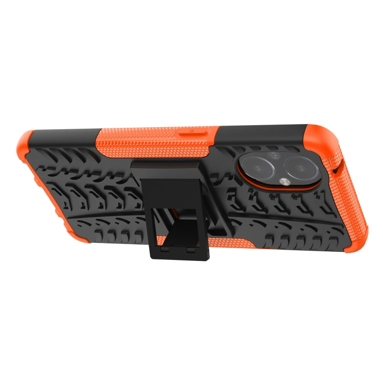 Orange and black shockproof phone case with tire tread grip and holder tab