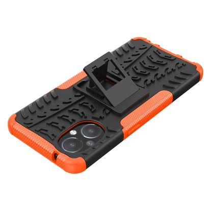 Orange and black rugged phone case with tire tread texture and kickstand holder