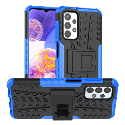 Blue and black shockproof phone case with textured grip, camera cutouts, and holder stand