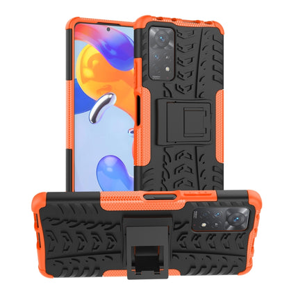 Shockproof phone case with holder, orange and black textured shell