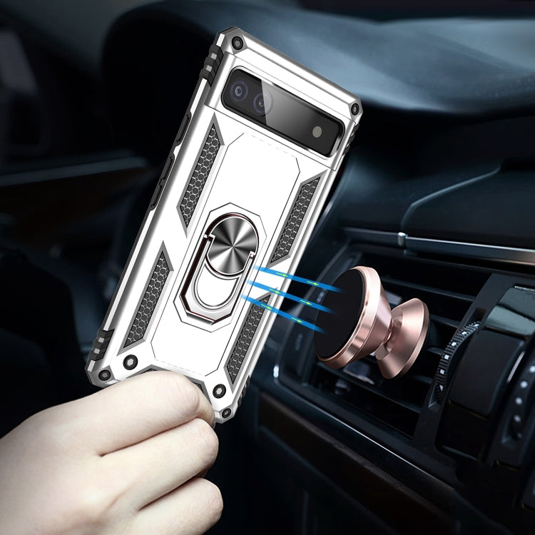 Silver protective phone case with rotating metal ring mount in a car