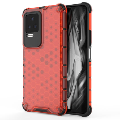 Shockproof phone case in red with honeycomb pattern, protective bumper and camera cutout