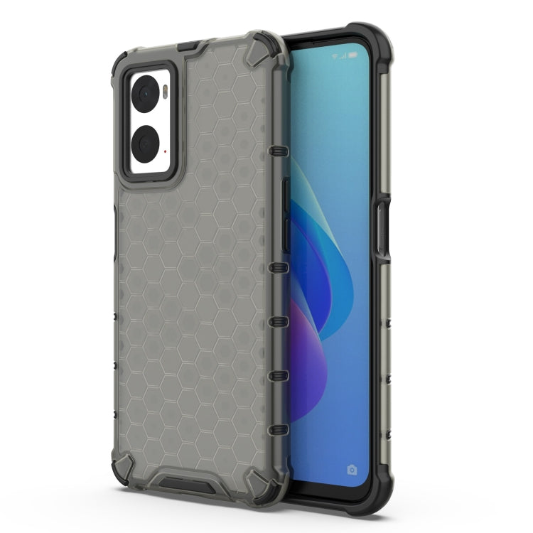 Gray protective phone case with honeycomb pattern, raised edges, and camera cutouts