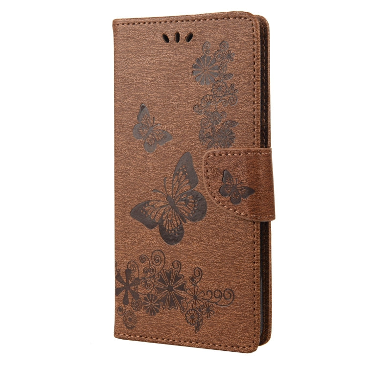 Brown butterfly embossed leather flip phone case with side snap closure