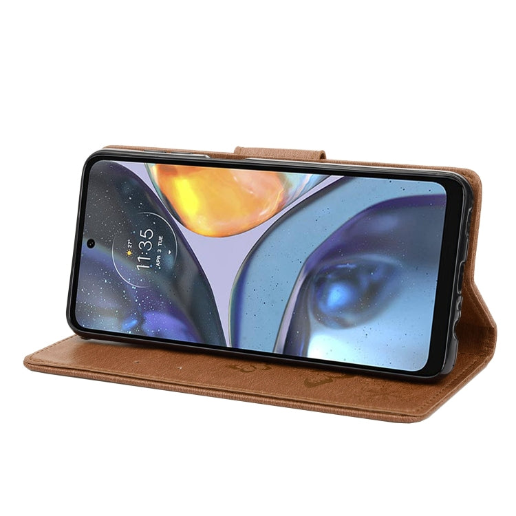 Brown butterfly embossed leather flip phone case with phone on display
