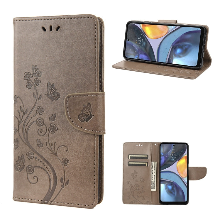 Brown leather phone case with butterfly and floral swirl pattern, folio style