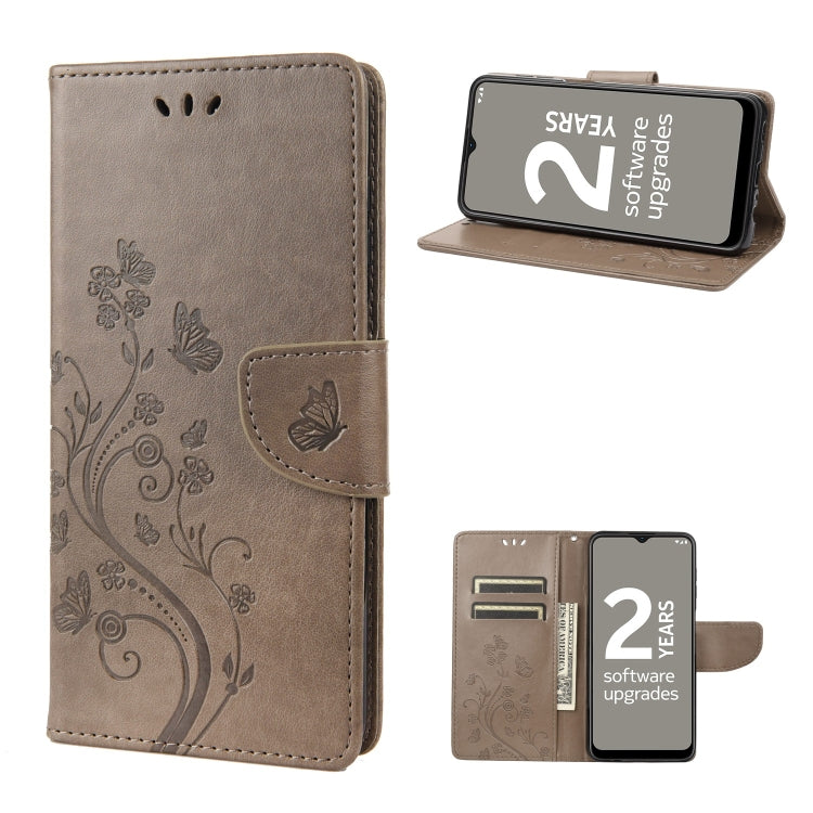 Brown leather folio phone case with butterfly floral pattern and flip cover