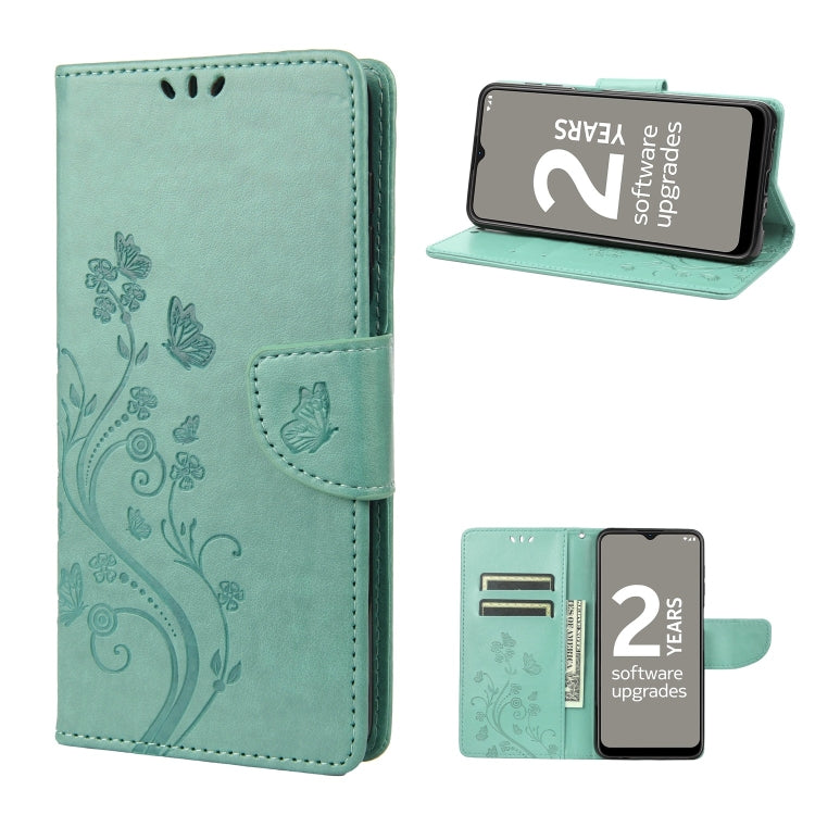 Teal leather phone wallet case with butterfly and floral pattern, folio stand and strap.