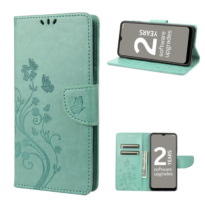 Teal leather phone wallet case with butterfly and floral pattern, folio stand and strap.