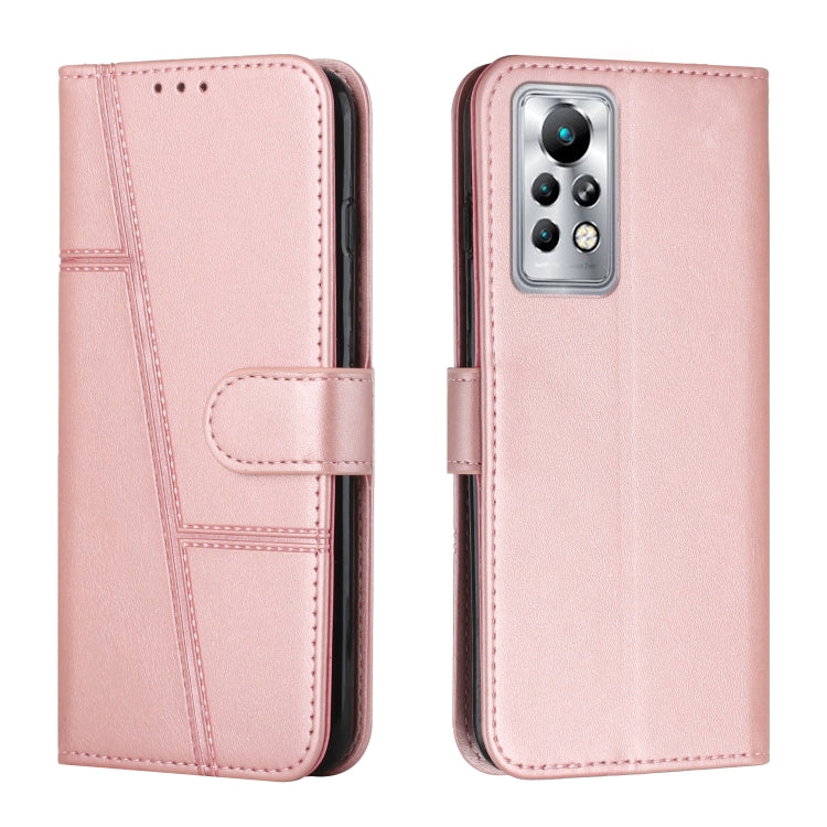 Pink leather flip phone case with stitched panels and foldover strap, rear lens cutout