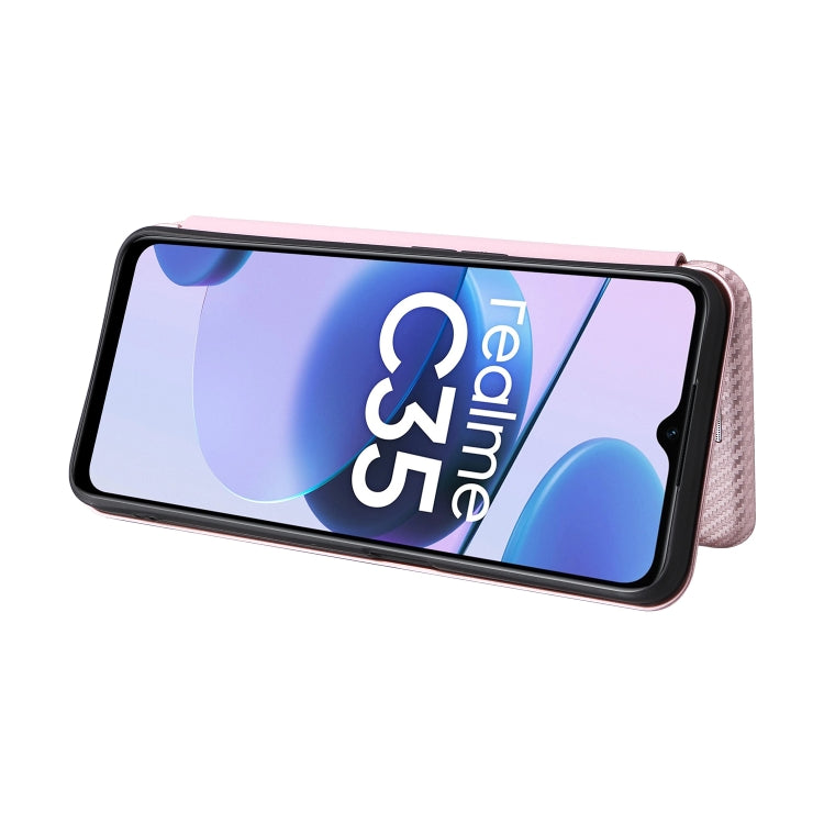 Pink carbon fiber texture magnetic flip phone case holding a phone with screen visible